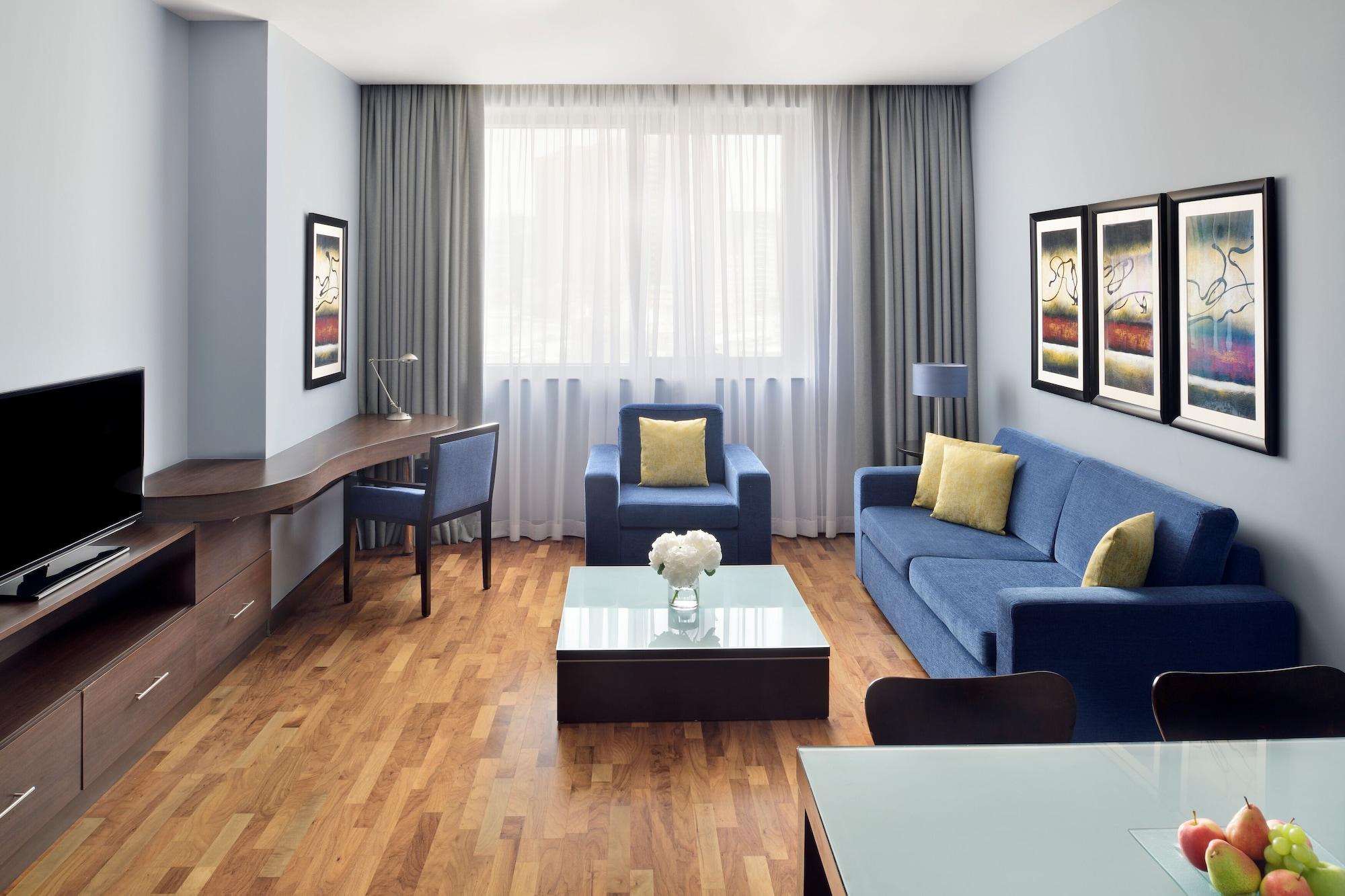 Moevenpick Hotel Apartments Al Mamzar Дубай Екстер'єр фото A typical living room